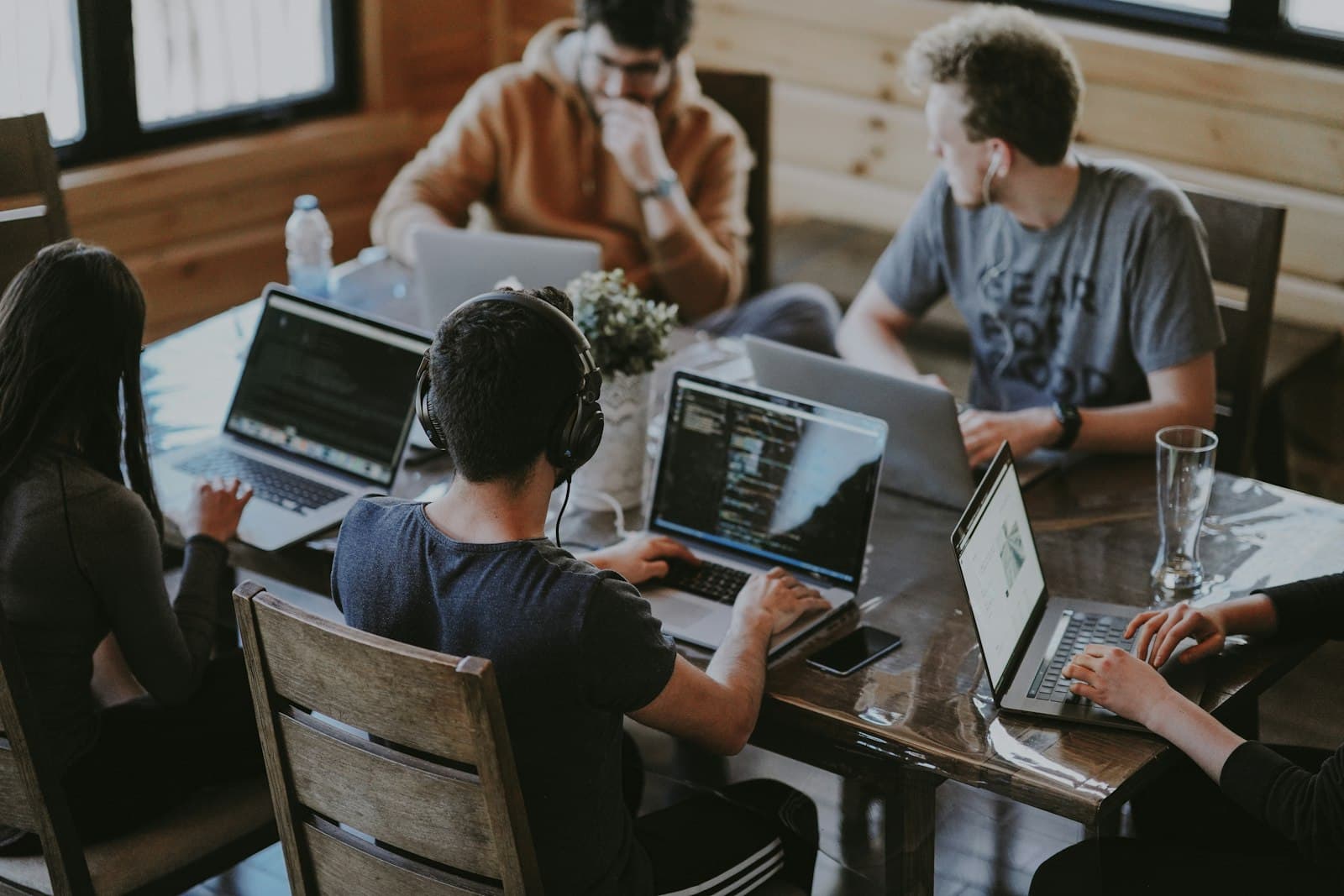 Cross-functional team validating a cloud software pilot before scaling